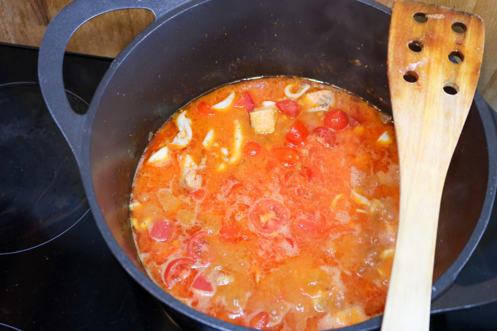 Tuscan Seafood Stew Adding Tomatoes