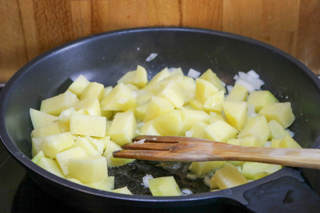 Add Potatoes and Garlic to Skillet