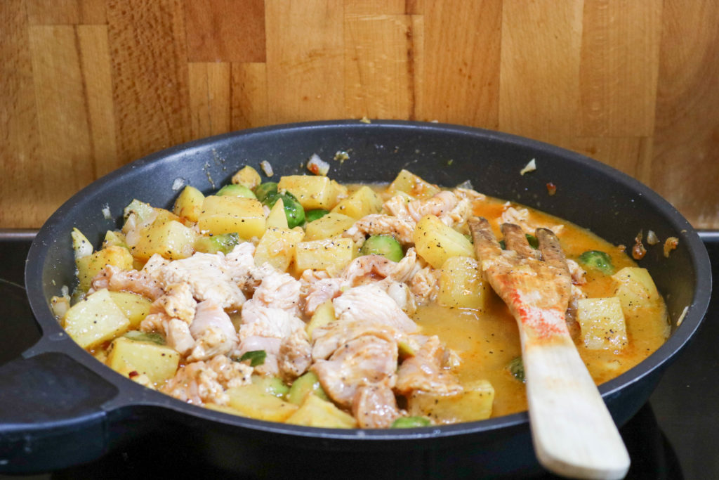 Add chicken broth and bring to a simmer