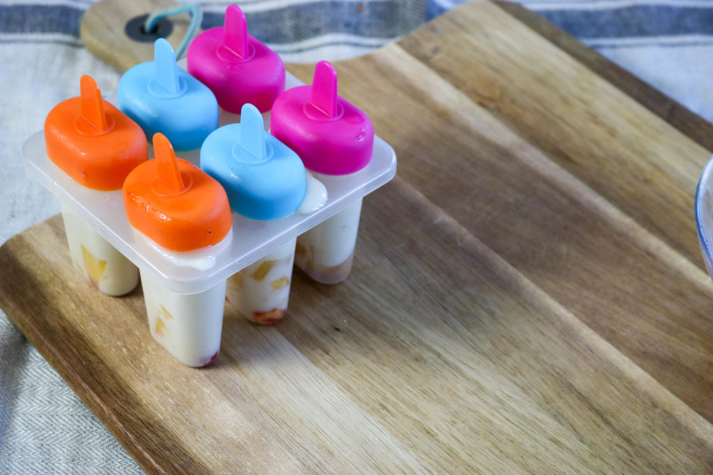 Put Top on Popsicle Container