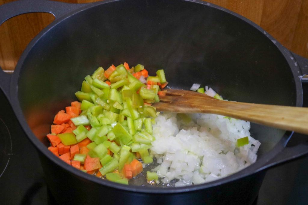 Add 2 tsp. oil, onion, carrot, and green pepper to skillet