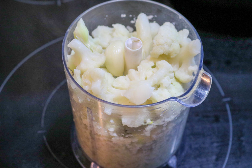 Put cauliflower and garlic in food processor