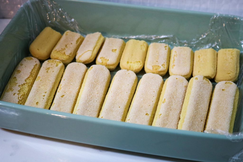 Place ladyfingers in a single layer into the bottom of the baking pan