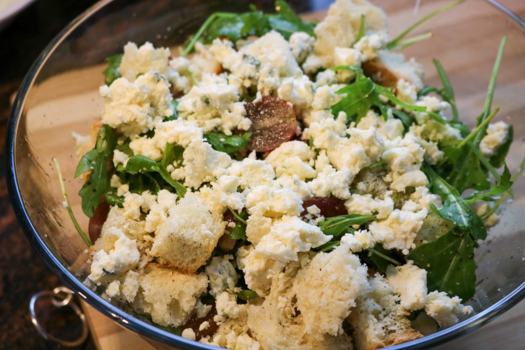 toss together the bread, grapes, arugula and blue cheese